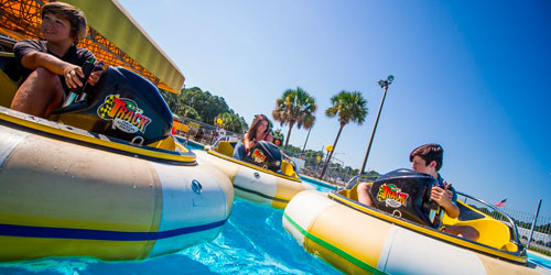 3 kids on bumper boats at The Track