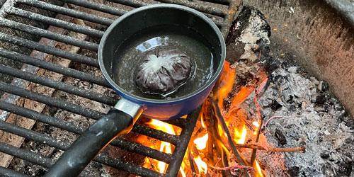 Preparing coffee sewn into filters and boiled over the fire Preparing coffee sewn into filters and boiled over the fire
