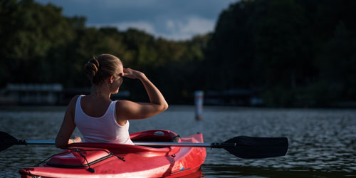 Woman kayaking on Fontana Lake Woman kayaking on Fontana Lake
