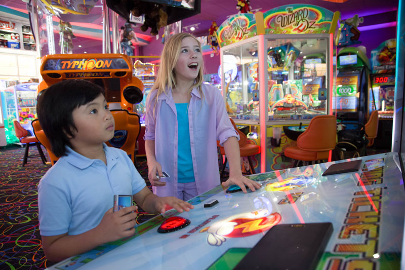 Two excited kids in an arcade