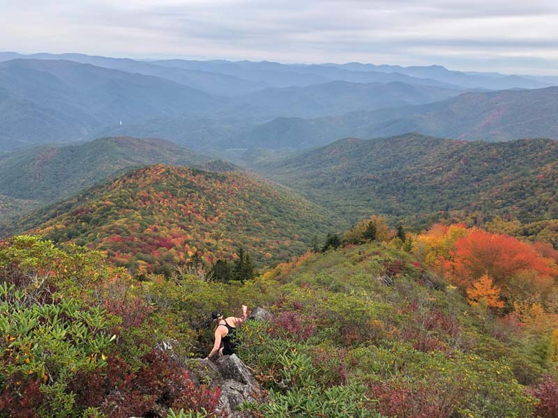 A brave hiker explores the rock outcroppings Mt. Cammerer Trail via Low Gap + AT