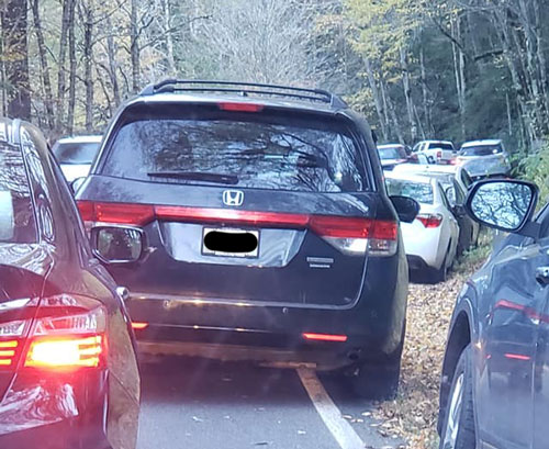 Large car parked in the road in front of Alum Cave Trail Large car parked in the road in front of Alum Cave Trail